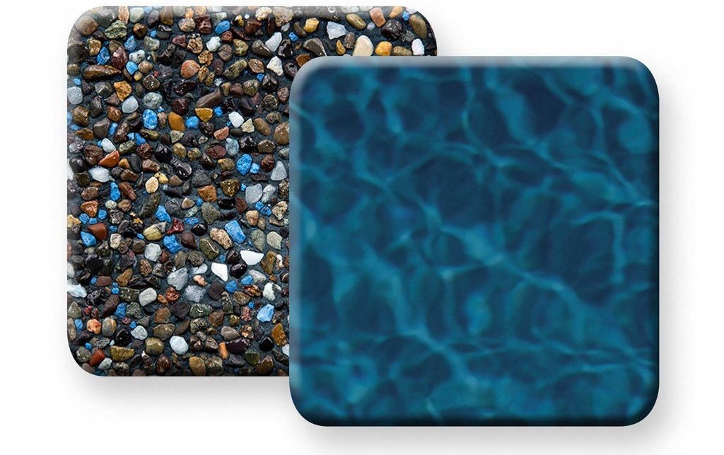Close-up of Pebble Tec pebble finish at waterline showing natural river pebbles and deep ocean blue water color in a South Florida pool